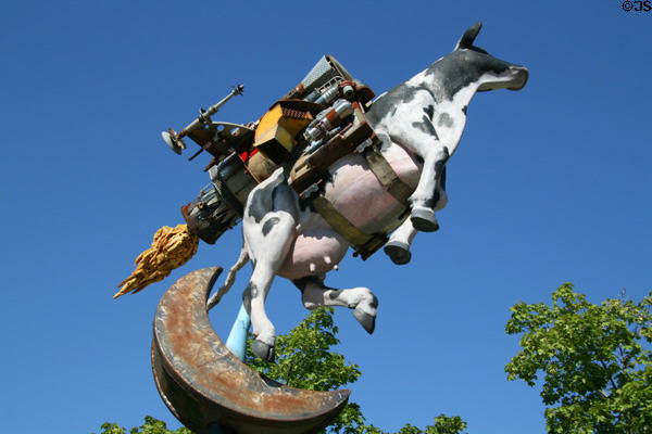 Flying Objects theme art of rocket powered cow over the moon by Michael J. Bingham near Convention Center. Salt Lake City, UT.