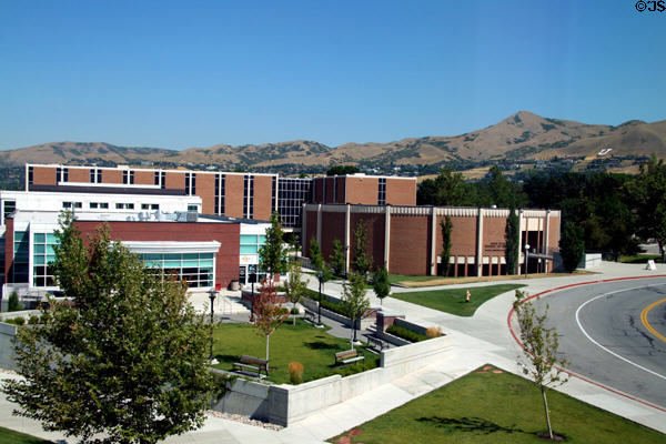 C. Roland Christensen, round Francis Armstrong Madsen & business school buildings plus mountains beyond on University of Utah campus. Salt Lake City, UT.