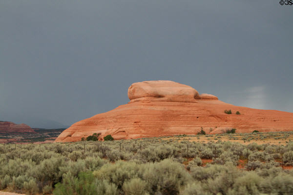 Bare sandstone mound along Highway US191 south of Moab. UT.