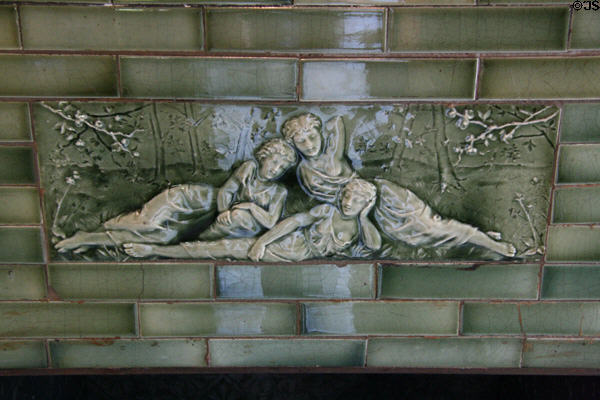 American encaustic tile three graces sculpture on library fireplace of Hunter House museum. Norfolk, VA.