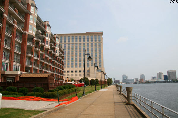 Apartments along Portsmouth waterfront with Norfolk skyline in distance. Portsmouth, VA.