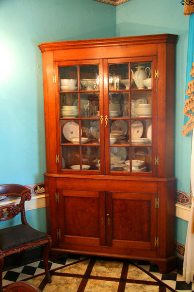 Corner cabinet with china in dining room of Ash Lawn-Highland. Charlotttesville, VA.