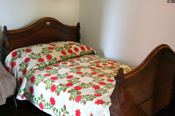 Woodrow Wilson bed with flower quilt at his Birthplace house. Staunton, VA.