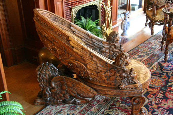 Carved oak chair supported on winged lions in library of Maymont Mansion. Richmond, VA.