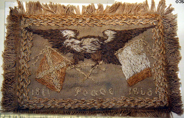 Embroidered eagle with two flags marking Peace at end (1866) of Civil War by wife of Col. Fletcher H. Archer using material from tent of Robert E. Lee at Siege Museum. Petersburg, VA.