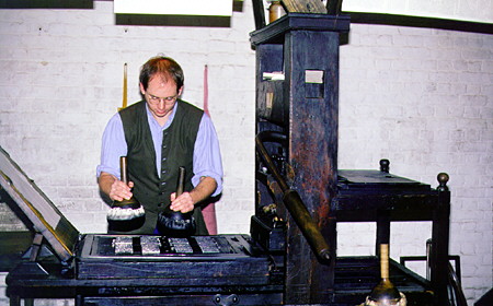 A printing press being inked. Williamsburg, VA.