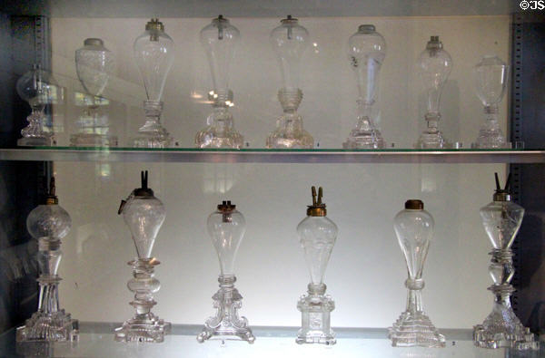 Collection of New England glass whale oil lamps (1830-40) at Bennington Museum. Bennington, VT.
