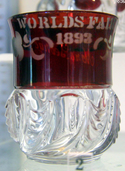 Glass tumbler with fused red stain made for Chicago World's Fair (1893) in York Herringbone Pattern from Pittsburgh, PA at Bennington Museum. Bennington, VT.