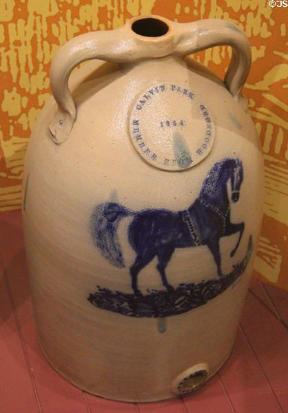 Stoneware jug with horse (1864) by E&LP Norton Pottery of Bennington, VT, presented to Calvin Park of Woodford, VT at Bennington Museum. Bennington, VT.