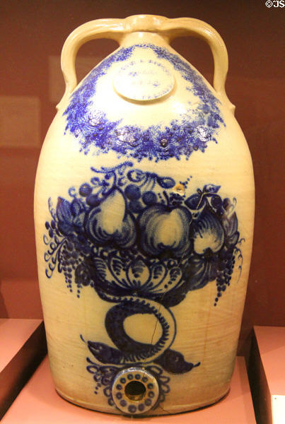 Stoneware water jug (1859) painted with fruit by J&E Norton Pottery of Bennington, VT at Bennington Museum. Bennington, VT.