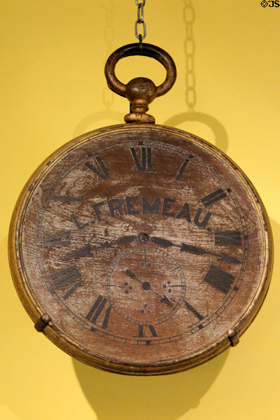 Watchmaker Louis Fremeau shop sign (19thC) from Burlington, VT at Shelburne Museum. Shelburne, VT.