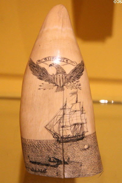 Scrimshaw whale tooth with whaling ship & hunt (19thC) at Shelburne Museum. Shelburne, VT.