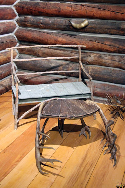 Rustic bench (c1900) & footstool supported by antlers in Beach Lodge at Shelburne Museum. Shelburne, VT.