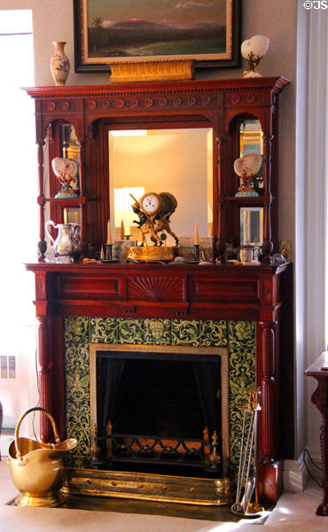 Sitting room fireplace display case overmantle & with encaustic tile surround at Marsh-Billings-Rockefeller Mansion. Woodstock, VT.