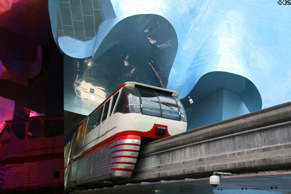 Monorail tunnels through blue & copper colored sections of EMP|FSM. Seattle, WA.