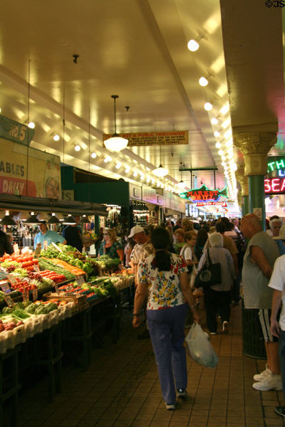 Shoppers in Main Arcade of Pike Place Market. Seattle, WA. On National Register.