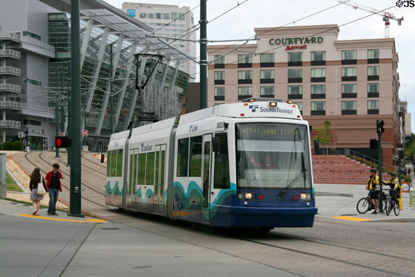 SoundTransit streetcar rolls past Tacoma Convention & Trade Center. Tacoma, WA.