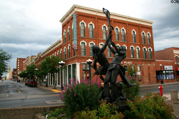 Looking up Main St. from Indians playing LaCrosse sculpture. La Crosse, WI.