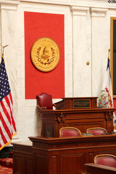 Desk of the President of Senate & replica of the Great Seal of West Virginia in Senate Chamber of West Virginia State Capitol. Charleston, WV.