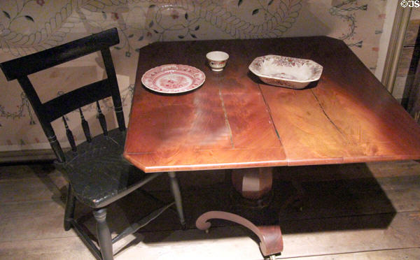 Swiveling card table (1810), Windsor side chair (c1840) plus ceramics at West Virginia State Museum. Charleston, WV.