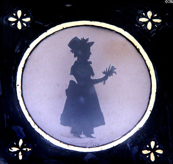 Early American silhouette of girl holding flowers at Craik-Patton House. Charleston, WV.