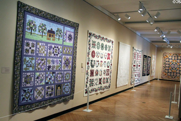 Quilt exhibit in art gallery at Discovery Museum of Clay