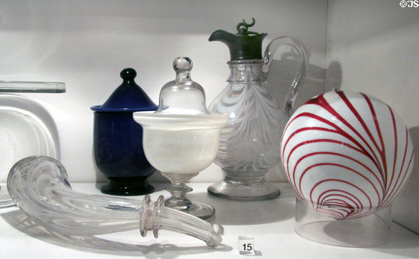 Whimsy powder horn (1860-70), covered sugar dishes (mid-19th C), Witch Ball (1845-60) & syrup decanter (1850-70) from the Ohio River Valley in glass gallery at Huntington Museum of Art. Huntington, WV.