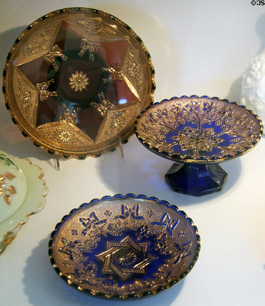 Dishes with "Bows & Blossom" and "Ribbons & Overlapping Squares" patterns and Bon Bon dish with "Grape Frieze" pattern (c1906) by Northwood Glass Co., Wheeling, WV in glass gallery at Huntington Museum of Art. Huntington, WV.