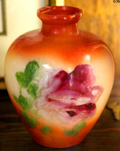 Milk glass vase with orange color gradient & flowers (1895-1915) at Fostoria Glass Museum. Moundsville, WV.