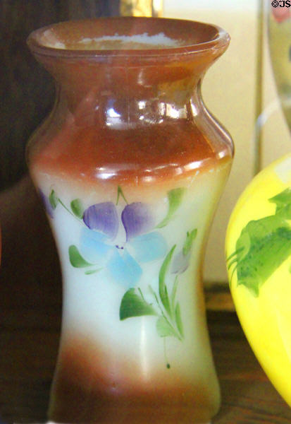 Vase with gradient of opal brown tint & blue flower (1900) at Fostoria Glass Museum. Moundsville, WV.
