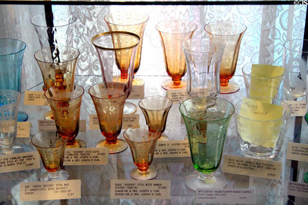 Amber & green etched footed glasses at Fostoria Glass Museum. Moundsville, WV.