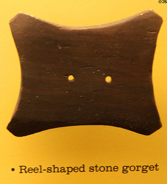 Reel-shaped stone gorget of early or middle Adena period at Grave Creek Mound Museum. Moundsville, WV.