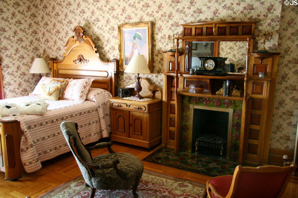 Bedroom with tile fireplace at Nagel Warren Mansion B&B. Cheyenne, WY.