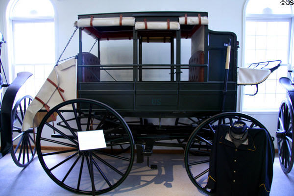U.S. Army Dougherty wagon (c1875) by Kansas Manuf. Co., Leavenworth, KS, with seats which folded flat to make ambulance at Cheyenne Frontier Days Old West Museum. Cheyenne, WY.