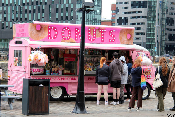 Pink donut stand in antique truck at Albert Dock. Liverpool, England.