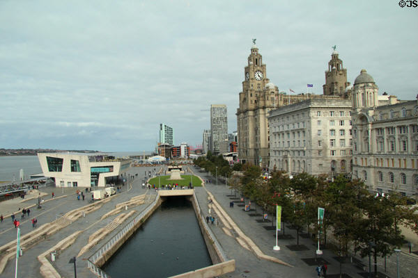 Ferry building, a canal extension (2007), modern highrises & heritage Three Graces buildings on Liverpool's Mersey River waterfront. Liverpool, England.