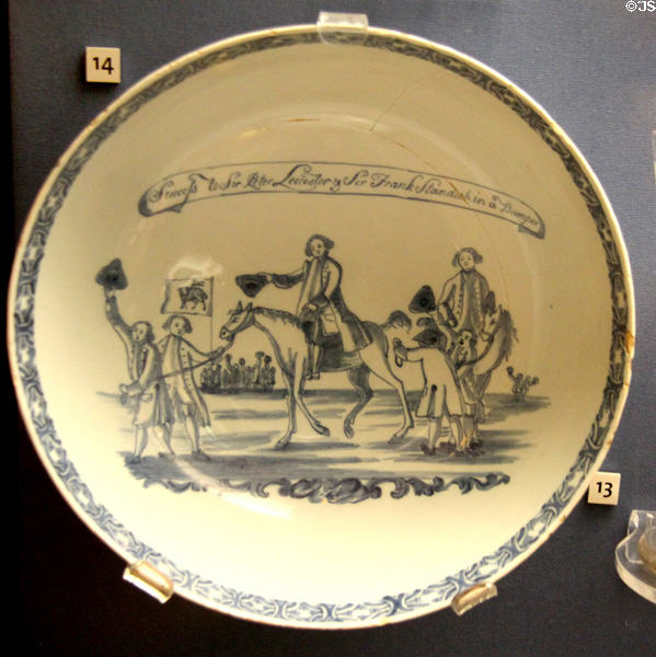 Tin-glazed earthenware punchbowl inscribed 'Success to Sir Peter Leicester & Sir Frank Standish in a Bumper' to promote their election by giving bumpers (drinks filled to the brim) (1768) from Liverpool at Walker Art Gallery. Liverpool, England.