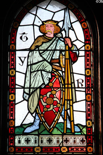 Stained glass window depicting Norse God Tyr in Winter Smoking Room, at Cardiff Castle. Cardiff, Wales.