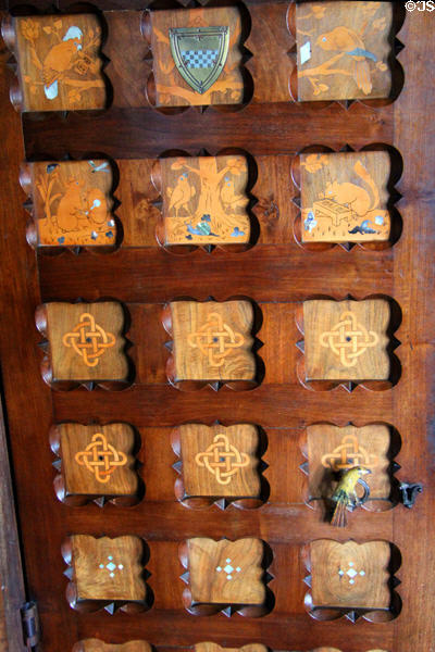 Panel with wood inlaid small animals & knots at Cardiff Castle in Winter Smoking Room. Cardiff, Wales.