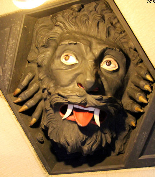 Carving of beast on threshold of Winter Smoking Room placed to scare women from entering at Cardiff Castle. Cardiff, Wales.