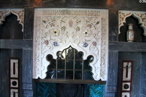 Fireplace & chimney piece carved with the name of William Burges as a memorial by Lord & Lady Bute to their architect in Arab Room at Cardiff Castle. Cardiff, Wales.