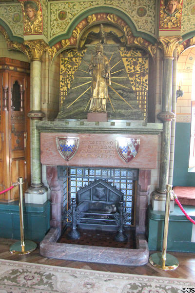 Fireplace & chimneypiece with statue of St John the Baptist, reflecting religious theme of room decorations in Lord Bute's bedroom at Cardiff Castle. Cardiff, Wales.