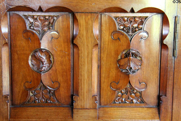 Detail of insect carving on wooden screen between bedroom & bathroom in Lord Bute's Bedroom at Cardiff Castle. Cardiff, Wales.