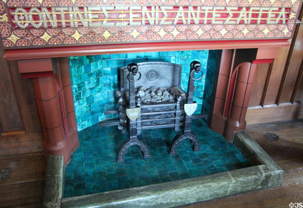 Greek inscription above fireplace translated as "Entertaining Angels Unawares" in Small Dining Room at Cardiff Castle. Cardiff, Wales.