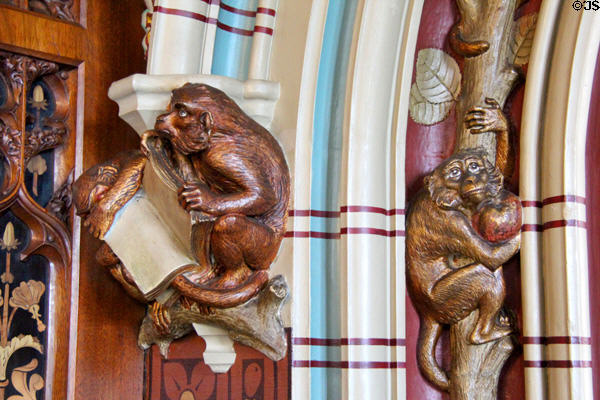 Sculptures of monkeys, one holding a book, & the other fruit in Library at Cardiff Castle. Cardiff, Wales.