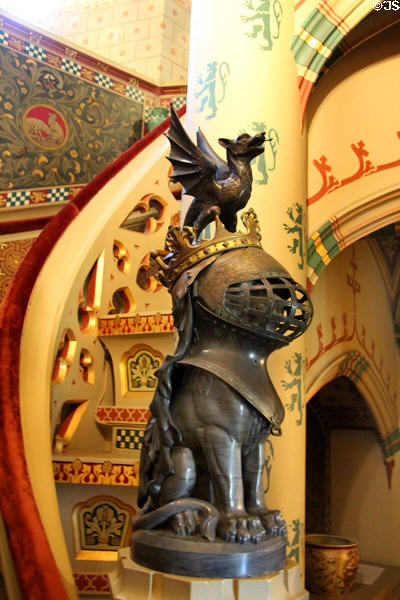 Base of spiral staircase guarded by armored animal & small dragon at Cardiff Castle. Cardiff, Wales.