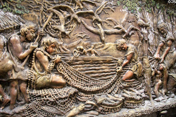 Silures fishing section on Roman Invasion of South Wales sculpted mural (1983) by Frank Abraham at Cardiff Castle,. Cardiff, Wales.