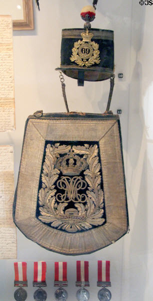 King's Dragoon Guards officer's helmet (1834-44); officer's William IV sabretache (flat bag or pouch carried together with saber) (1831-7); & Canada General Service Medals (awarded 1866-70) in Military Museum at Cardiff Castle. Cardiff, Wales.