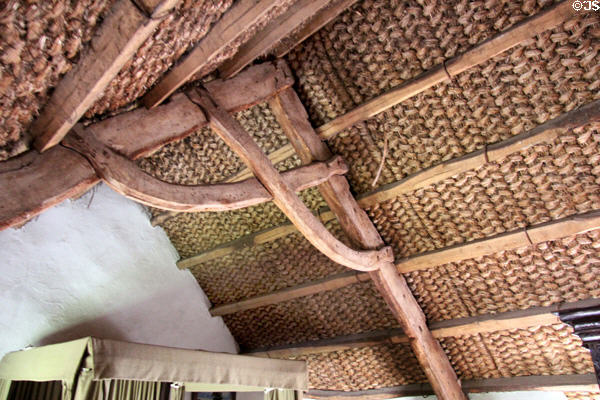 Straw mats lining upstairs ceiling which are tied to straw roof to keep it from blowing away in Kennixton Farmhouse at St Fagans National Museum of History. Cardiff, Wales.