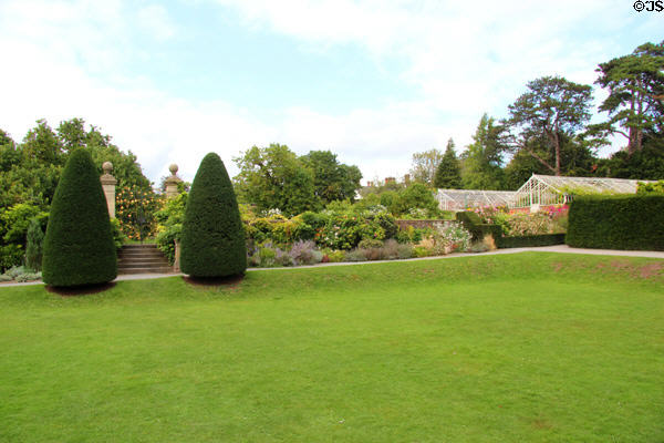 Expanse of lawn, topiary & shrubs at St Fagans Castle. Cardiff, Wales.